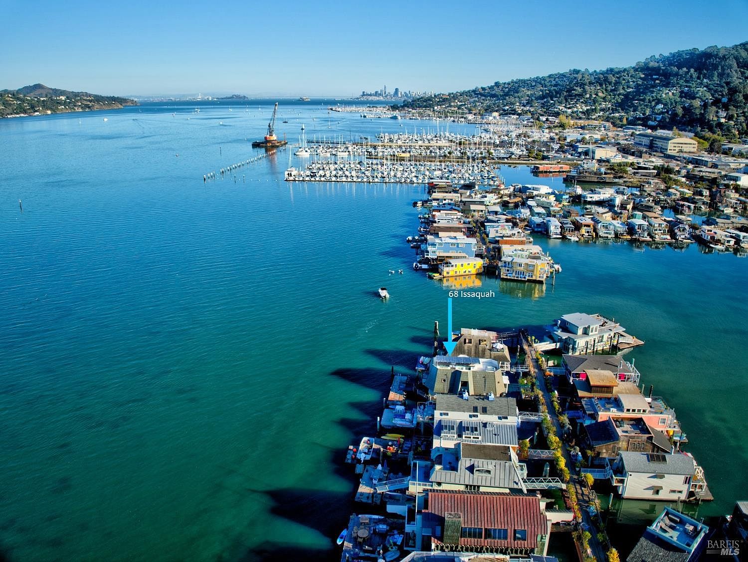 Aerial view of the Sausalito floating-home community, with 68 Issaquah Dock marked, the marina and San Francisco skyline visible across the bay.